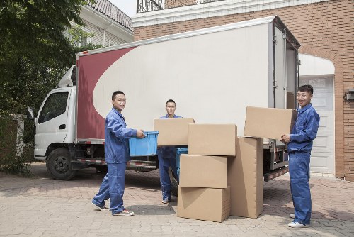 Man with van loading furniture for a local move in Ilford