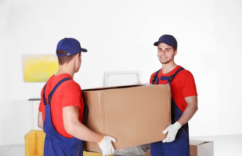 Removal team planning a house move in Ilford with boxes and furniture