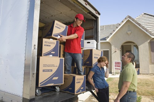 Professional movers loading household items for a short notice move