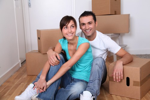 Local Ilford moving specialists organizing furniture and boxes